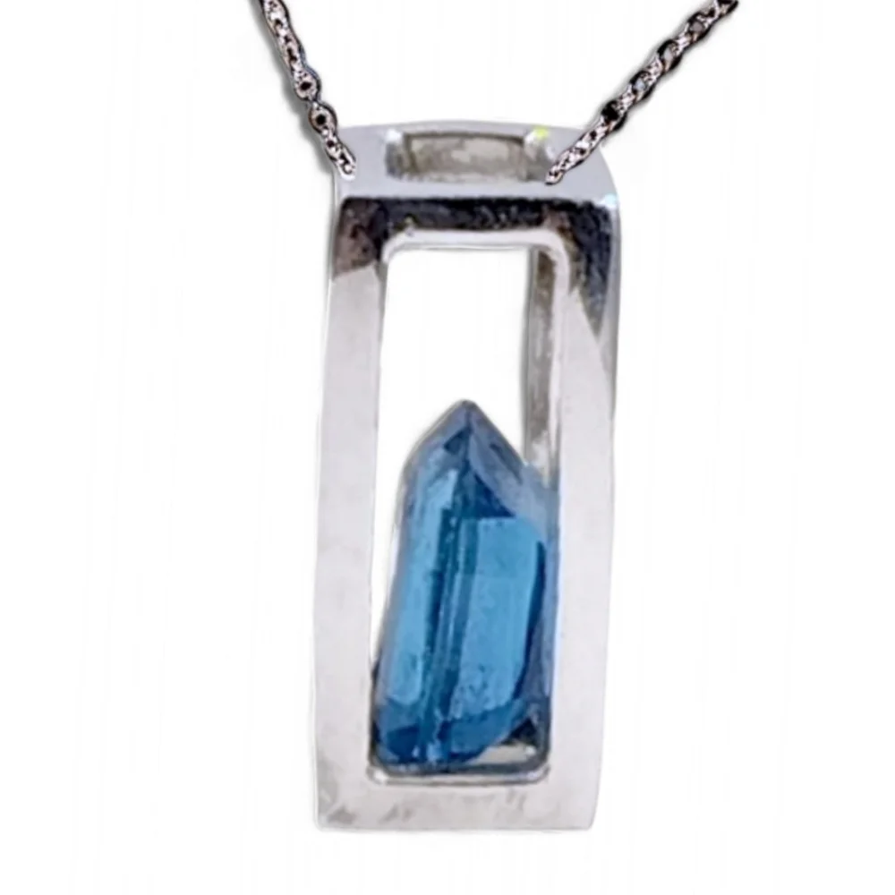 Sterling Silver Open Frame Pendant with Floating Blue Topaz on Stainless Chain